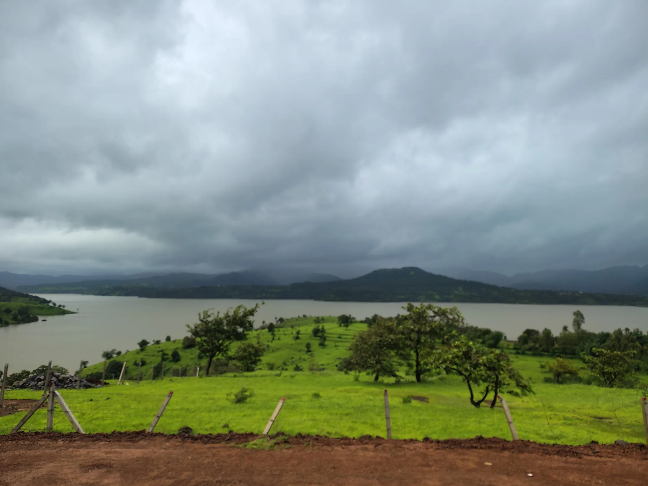 Clouds and green land overlooking the dam